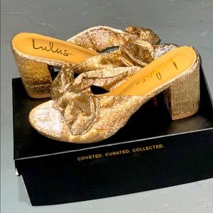 Size 8 rose gold metallic slip on sandals with bow. New and never worn.